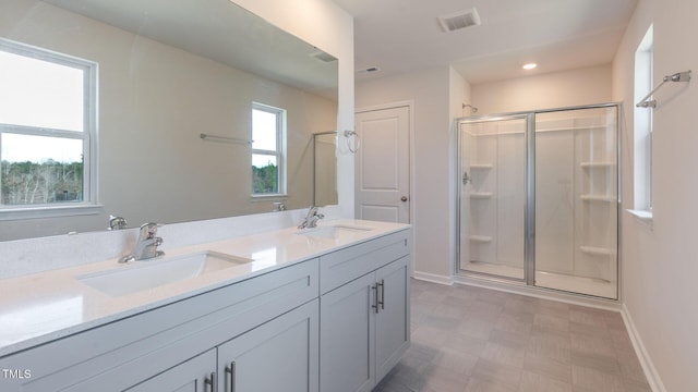 170 Babbling Creek Dr, Youngsville, NC 27596 - full bathroom with a stall shower, tile patterned floors, and double vanity