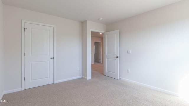 170 Babbling Creek Dr, Youngsville, NC 27596 - unfurnished bedroom featuring light carpet and baseboards