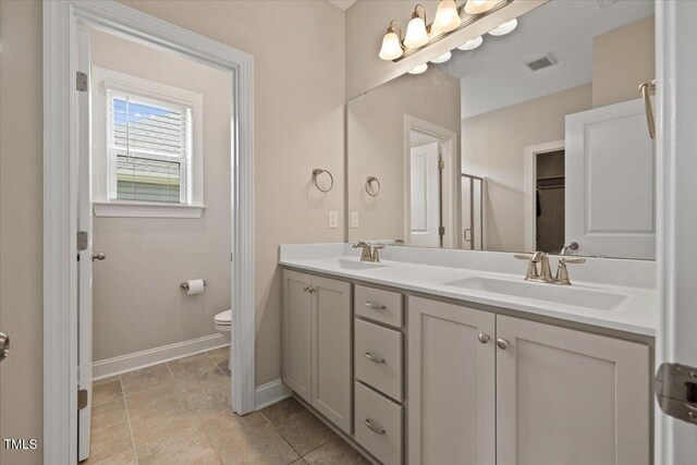 824 Stanly House St, Wake Forest, NC 27587 - bathroom featuring double vanity and baseboards