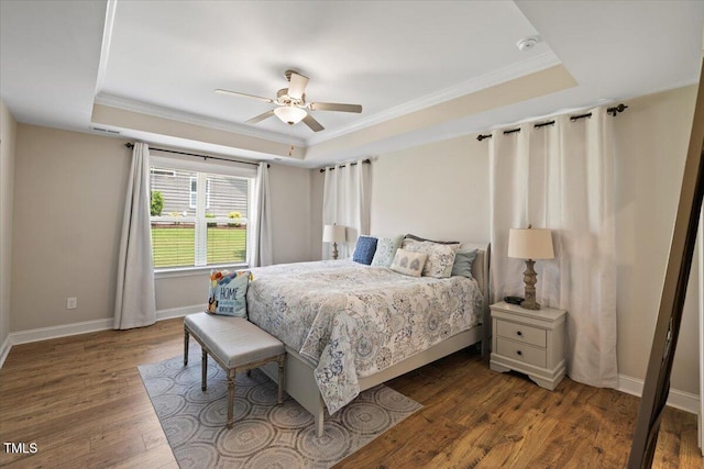 824 Stanly House St, Wake Forest, NC 27587 - bedroom featuring a raised ceiling, ornamental molding, wood finished floors, and ceiling fan