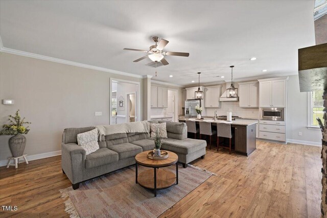 824 Stanly House St, Wake Forest, NC 27587 - living area with a ceiling fan, ornamental molding, light wood finished floors, and recessed lighting