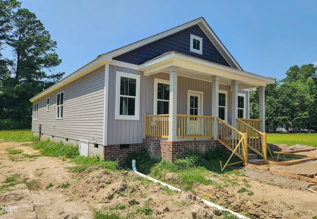 213 Maye St, Dunn, NC 28334 - view of front facade with crawl space and a porch