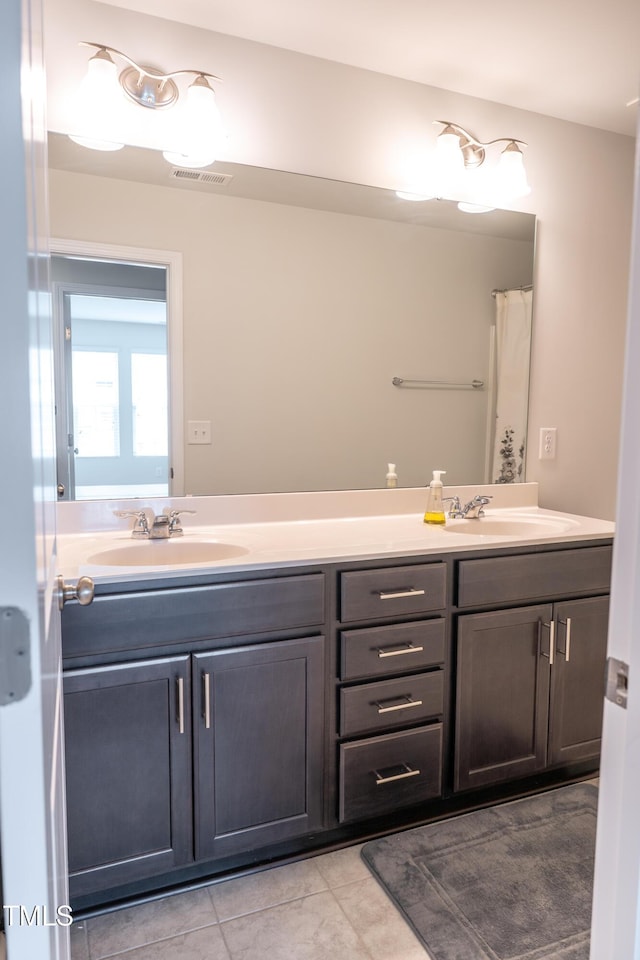 1402 Southpoint Trl, Durham, NC 27713 - bathroom featuring double vanity and tile patterned flooring
