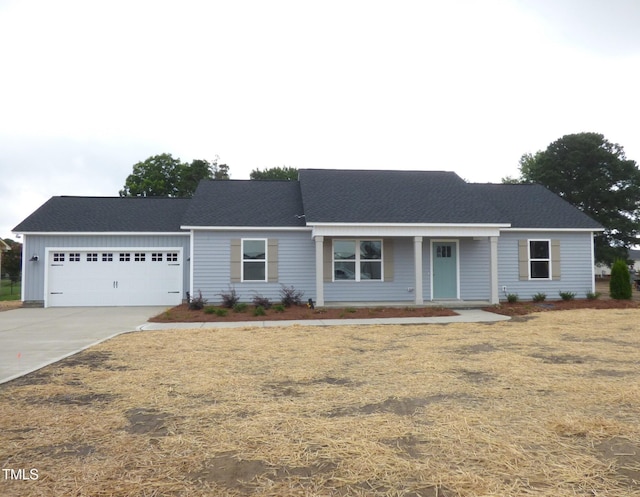 5610 Plain View Highway, Dunn, NC 28334 - ranch-style home featuring an attached garage, concrete driveway, board and batten siding, and a front yard
