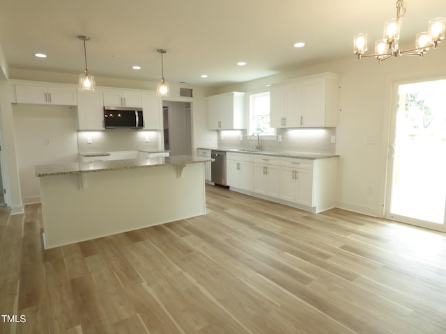 5610 Plain View Highway, Dunn, NC 28334 - kitchen featuring appliances with stainless steel finishes, white cabinetry, recessed lighting, and light wood-style floors