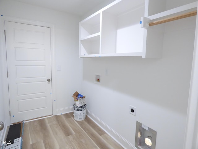 5610 Plain View Highway, Dunn, NC 28334 - laundry area featuring electric dryer hookup, wood finished floors, and washer hookup