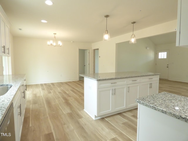 5610 Plain View Highway, Dunn, NC 28334 - kitchen featuring light wood-style floors, a chandelier, stainless steel dishwasher, a center island, and white cabinets