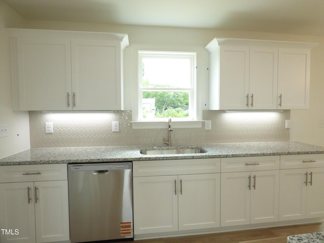 5610 Plain View Highway, Dunn, NC 28334 - kitchen with stainless steel dishwasher, white cabinets, light stone counters, and decorative backsplash