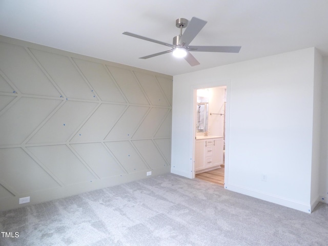 5610 Plain View Highway, Dunn, NC 28334 - unfurnished bedroom featuring light colored carpet, connected bathroom, and ceiling fan