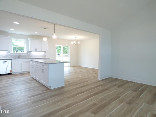 5610 Plain View Highway, Dunn, NC 28334 - kitchen with stainless steel dishwasher, plenty of natural light, white cabinetry, a chandelier, and recessed lighting