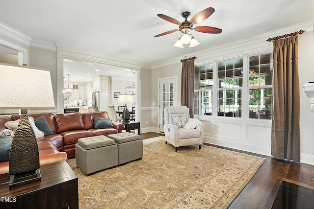 164 Avocet Ln, Clayton, NC 27520 - living room with wood finished floors, a ceiling fan, and crown molding