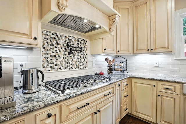 164 Avocet Ln, Clayton, NC 27520 - kitchen with custom exhaust hood, decorative backsplash, and light stone counters