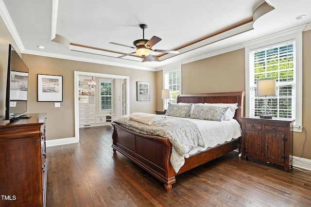164 Avocet Ln, Clayton, NC 27520 - bedroom featuring a tray ceiling, wood finished floors, multiple windows, crown molding, and a chandelier