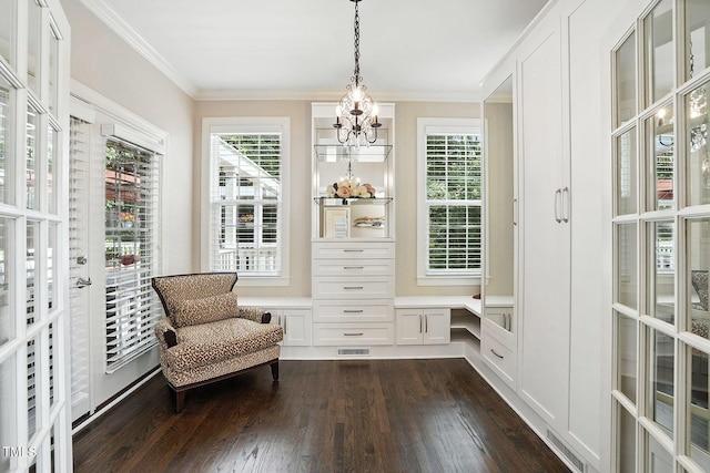 164 Avocet Ln, Clayton, NC 27520 - living area with dark wood-type flooring, crown molding, a chandelier, and plenty of natural light