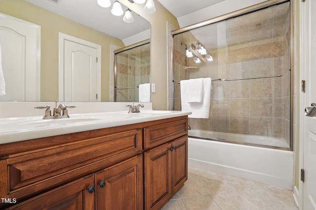 164 Avocet Ln, Clayton, NC 27520 - bathroom with double vanity, tile patterned floors, and bath / shower combo with glass door