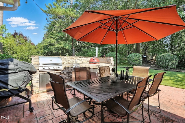 164 Avocet Ln, Clayton, NC 27520 - view of patio with area for grilling, outdoor dining space, and view of scattered trees