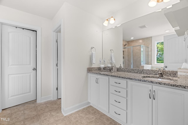 1321 White Spruce Dr, Willow Springs, NC 27592 - full bath with double vanity, a stall shower, and tile patterned floors