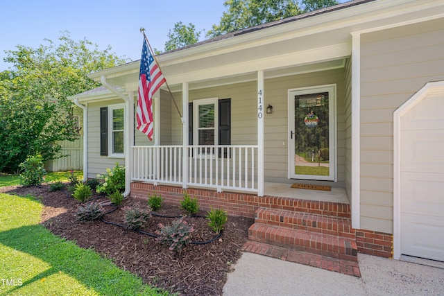 4140 Willow Haven Ct, Raleigh, NC 27616 - property entrance featuring a porch and a garage