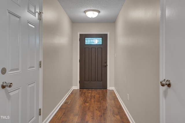 4140 Willow Haven Ct, Raleigh, NC 27616 - doorway featuring dark wood-style floors and a textured ceiling
