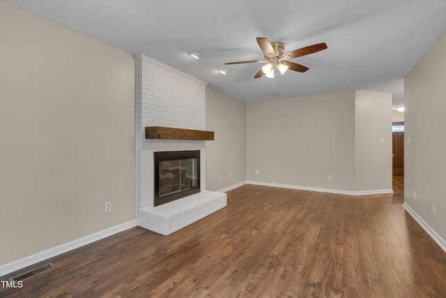 4140 Willow Haven Ct, Raleigh, NC 27616 - unfurnished living room featuring ceiling fan, wood finished floors, and a brick fireplace
