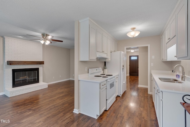 4140 Willow Haven Ct, Raleigh, NC 27616 - kitchen with white appliances, open floor plan, under cabinet range hood, light countertops, and a textured ceiling