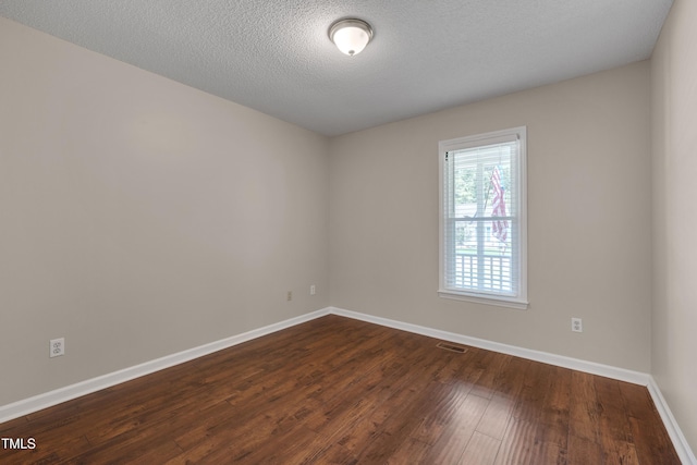 4140 Willow Haven Ct, Raleigh, NC 27616 - unfurnished room with dark wood finished floors and a textured ceiling
