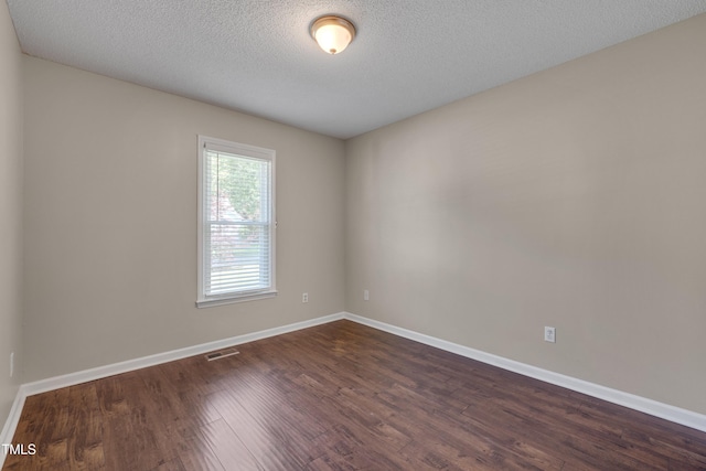 4140 Willow Haven Ct, Raleigh, NC 27616 - unfurnished room featuring dark wood finished floors and a textured ceiling