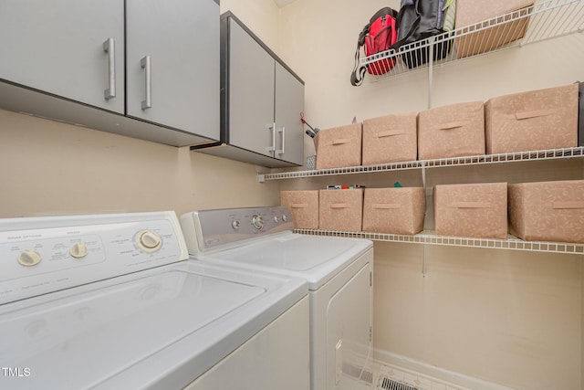302 Caraway Ln, Cary, NC 27519 - laundry area with separate washer and dryer and cabinet space