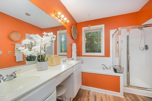 302 Caraway Ln, Cary, NC 27519 - full bathroom with a stall shower, a bath, wood finished floors, and double vanity