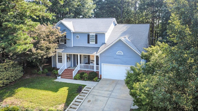 302 Caraway Ln, Cary, NC 27519 - view of front facade with covered porch, concrete driveway, an attached garage, a front lawn, and roof with shingles