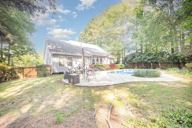 302 Caraway Ln, Cary, NC 27519 - rear view of property featuring a fenced backyard, a patio area, and a gate
