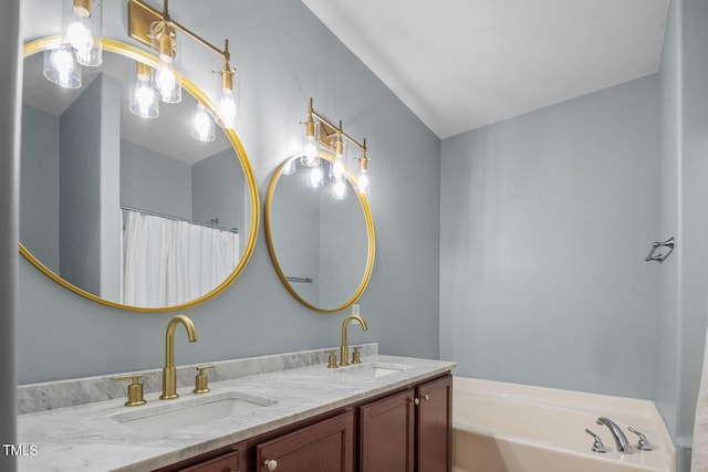 145 Mariah Towns Way, Garner, NC 27529 - bathroom with double vanity and a garden tub