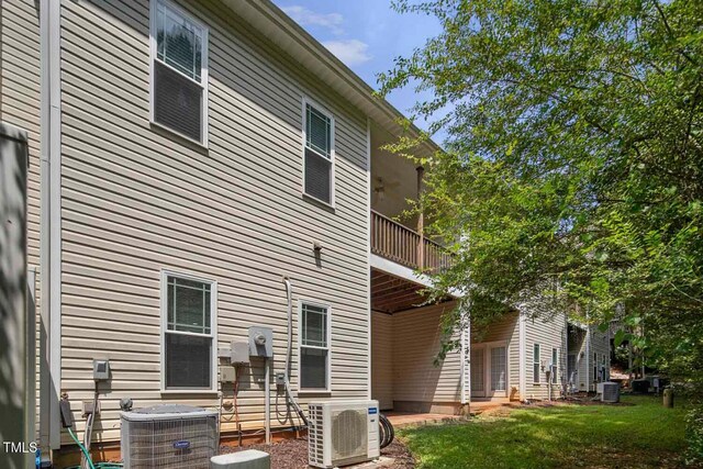 145 Mariah Towns Way, Garner, NC 27529 - rear view of property featuring a balcony and a yard
