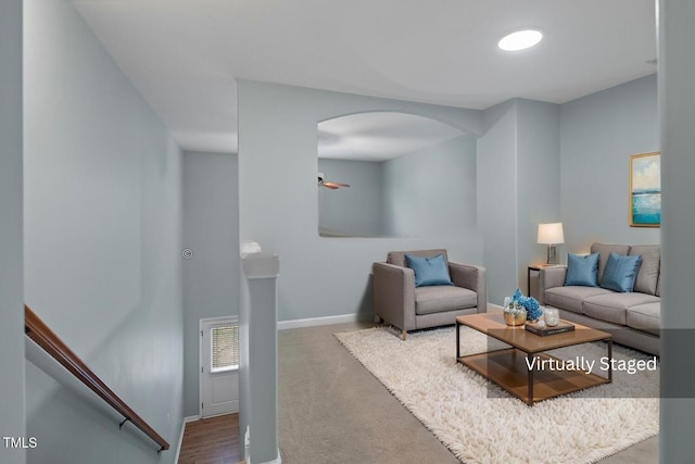 145 Mariah Towns Way, Garner, NC 27529 - carpeted living room with arched walkways and baseboards