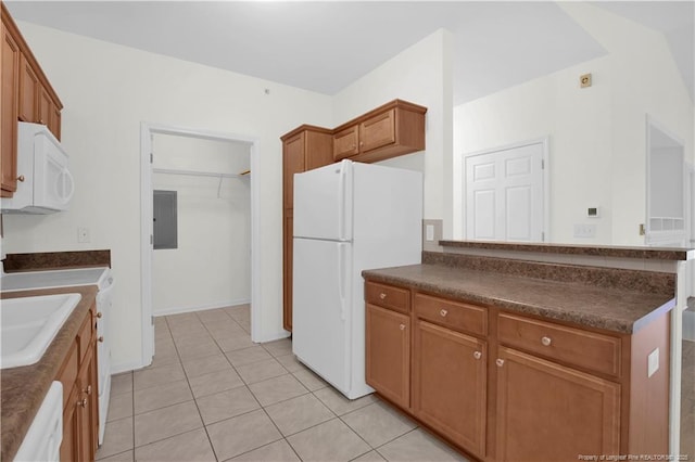 612 Marshtree Ln Unit 304, Fayetteville, NC 28314 - kitchen with white appliances, dark countertops, and light tile patterned flooring