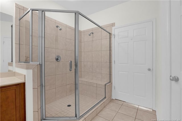 612 Marshtree Ln Unit 304, Fayetteville, NC 28314 - bathroom featuring vanity, tile patterned flooring, and a stall shower