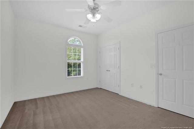 612 Marshtree Ln Unit 304, Fayetteville, NC 28314 - unfurnished bedroom with carpet flooring, a closet, and a ceiling fan