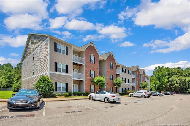 612 Marshtree Ln Unit 304, Fayetteville, NC 28314 - view of building exterior with uncovered parking