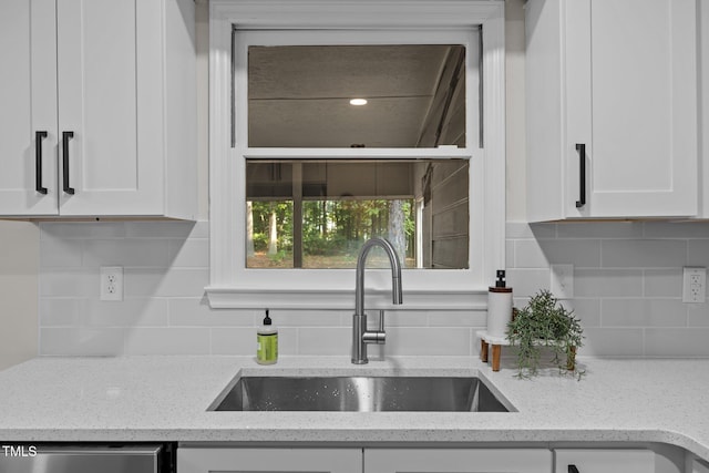 5721 Meadow Run, Knightdale, NC 27545 - kitchen featuring white cabinets, tasteful backsplash, and light stone counters