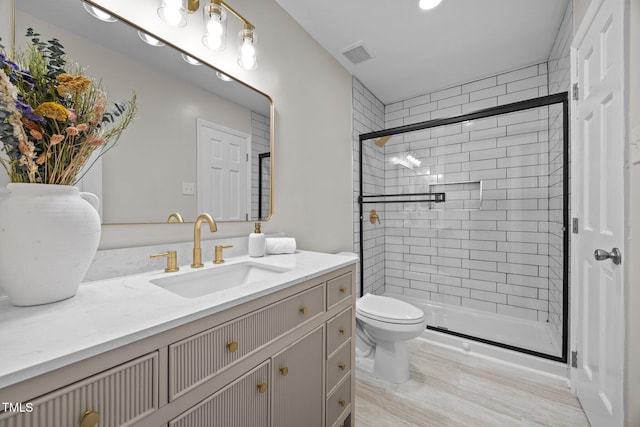 5721 Meadow Run, Knightdale, NC 27545 - bathroom featuring vanity, a stall shower, and wood finished floors