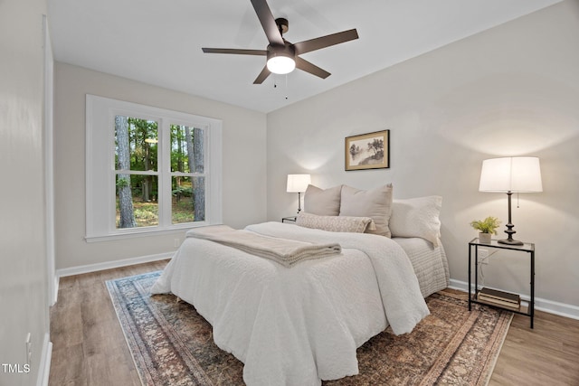 5721 Meadow Run, Knightdale, NC 27545 - bedroom with wood finished floors and ceiling fan