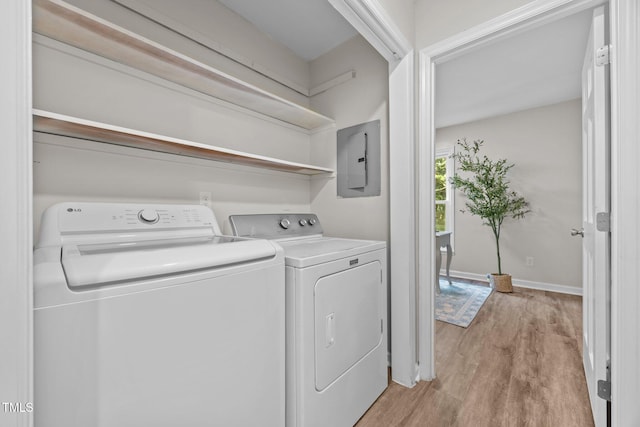5721 Meadow Run, Knightdale, NC 27545 - washroom featuring electric panel, light wood finished floors, and washing machine and dryer
