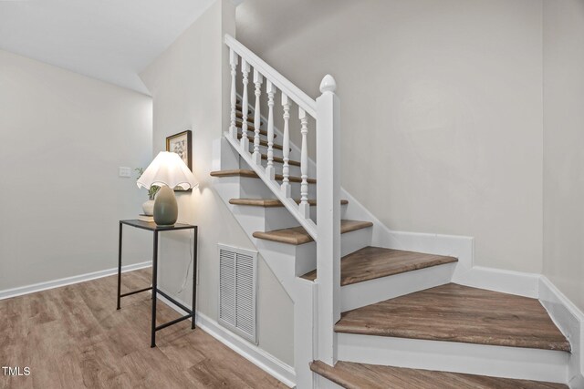 5721 Meadow Run, Knightdale, NC 27545 - staircase featuring wood finished floors and baseboards