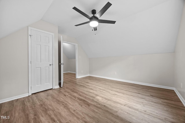 5721 Meadow Run, Knightdale, NC 27545 - additional living space featuring vaulted ceiling, wood finished floors, and ceiling fan