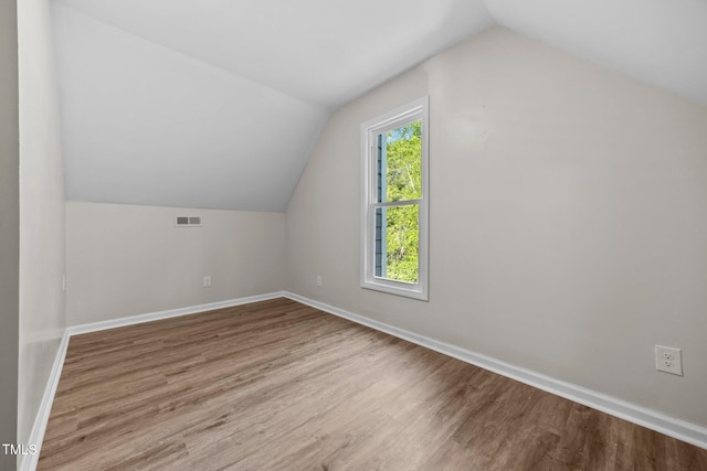 5721 Meadow Run, Knightdale, NC 27545 - additional living space featuring lofted ceiling and wood finished floors