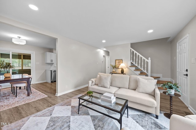 5721 Meadow Run, Knightdale, NC 27545 - living area featuring stairs, light wood-style flooring, and recessed lighting