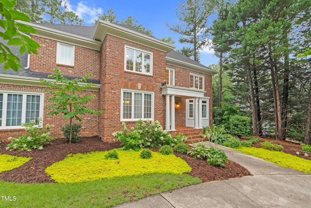 105 Bathgate Ln, Cary, NC 27513 - colonial-style house featuring brick siding and roof with shingles