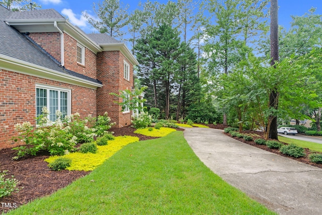 105 Bathgate Ln, Cary, NC 27513 - view of grassy yard featuring driveway