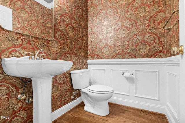 105 Bathgate Ln, Cary, NC 27513 - half bath featuring wallpapered walls and wood finished floors