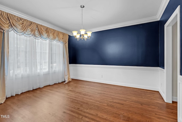 105 Bathgate Ln, Cary, NC 27513 - spare room featuring a chandelier, wood finished floors, and crown molding